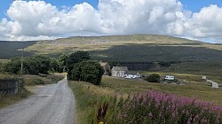Whernside 2417 feet up behind The Station Inn at Ribblehead